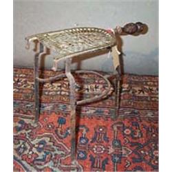 AN IRON AND BRASS TRIVET, 18th CENTURY, with turned wood handle....