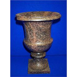 A POLISHED GRANITE URN SHAPED VASE, 32cms high....