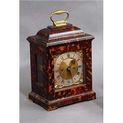 A BRACKET CLOCK, IN 18th CENTURY STYLE, in tortoiseshell domed case, with steel chapter ring and...