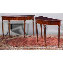 A PAIR OF MAHOGANY SHALLOW D-SHAPED SIDE TABLES, c.1800, with ribbed rims, plain aprons, on turne...