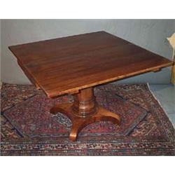 A MAHOGANY TILT TOP SUPPER TABLE, c.1840, rectangular with plain frieze, on tapering pillared cen...