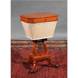 A BURR MAPLE WORK TABLE, EARLY 19th CENTURY, the lidded top with canted corners and a band of ros...