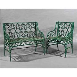 A SUITE OF GREEN PAINTED CAST IRON GOTHIC GARDEN FURNITURE, 19th CENTURY;, 1. A seat, 127cms wi...