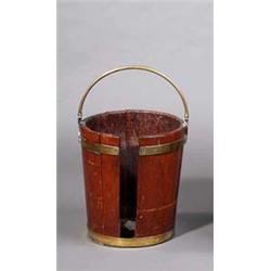 A MAHOGANY PLATE BUCKET, c.1800, of coopered construction, brass bound with swing handle, 40cms...