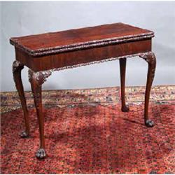 A MAHOGANY CONCERTINA ACTION FOLD-OVER TOP CARD TABLE, IRISH, mid 18th CENTURY, the baized interi...