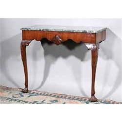 A MAHOGANY CONSOLE TABLE, IRISH, c.1760, with a Connemara marble top, the shaped apron centred by...