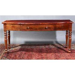 A MAHOGANY SERVING TABLE, IRISH, EARLY 19th CENTURY, of shallow bowed breakfront outline with cen...