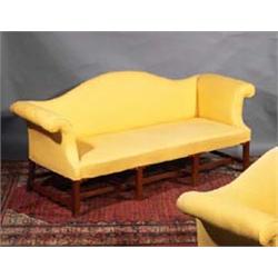 A MATCHED PAIR OF MAHOGANY FRAMED UPHOLSTERED HUMPED BACK SOFAS, with scroll arms, square legs jo...