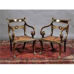 A PAIR OF EBONISED AND PARCEL GILT OPEN ARMCHAIRS, EARLY 19th CENTURY, with tablet backs above a...