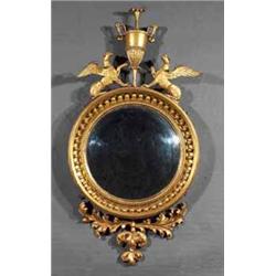 A GILTWOOD CONVEX MIRROR, 19th CENTURY, the moulded frame with a ropetwist border and set with sp...