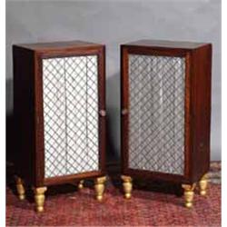 A PAIR OF ROSEWOOD AND PARCEL GILT PEDESTAL CABINETS, each fitted with a drawer with wire trellis...