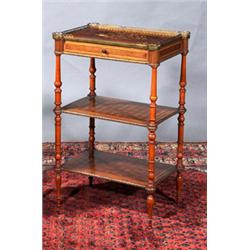 A WALNUT AND PARQUETRY THREE TIER WHAT-NOT, MID 19th CENTURY, with galleried top, fitted with a d...