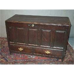 A OAK COFFER, EARLY 18th CENTURY, with panelled front, fitted with two drawers,, 115cms wide....