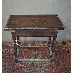 AN OAK PLANK TOP JOINTED TABLE, on baluster turned legs with a lobed stretcher, 77cms x 50cms...