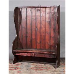 A PAIR OF PINE PLANKED SETTLES, PROBABLY FROM DEVON, one applied with a horseshoe, slightly conca...