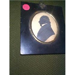 A 19th CENTURY SILHOUETTE PORTRAIT OF A MAN IN A PROFILE,, 8.5cms x 7cms....