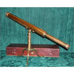 A 19th century lacquered brass telescope on tripod stand, with mahogany case and accessories. (I...