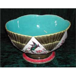 A large 19th century Wedgwood majolica punchbowl, diameter 34cm (several cracks). (Illustrated)...