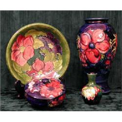 A large Moorcroft vase with poppy decoration on blue ground, height 25.5cm. (Illustrated)...