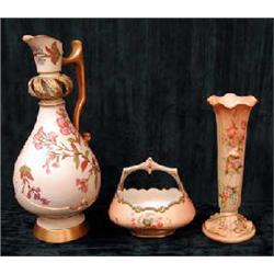 A late 19th century Grainger & Co serpent vase with blush ivory ground and floral decoration, he...