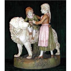 A large Royal Dux porcelain figural group depicting a girl helping a young boy to dismount from...