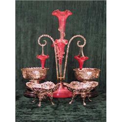 A large Victorian cranberry and clear glass four branch epergne, height 60cm. (Illustrated)...