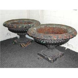 A pair of 19th century Britannia foundry cast iron campana form garden urns. (Illustrated)...