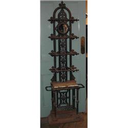 A good 19th century cast iron hallstand with circular mirror back. (Illustrated)...