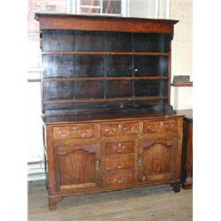 A good 18th century oak dresser with plate rack above an arrangement of six drawers and two pane...