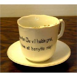 Mustache mug with saucer from Porsgrund in Norway. "Vis Knebelsbarten Du vil holde grei, glem ik...