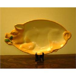 Plate from Egersund Fayancefabrik, Norway. Shaped as a pig. Length 40 cm. NOK 1000-1200,-...