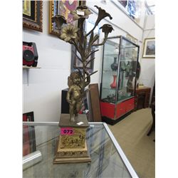 Porcelain and brass cupid candle holder