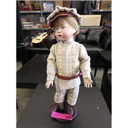 Boy doll on a stand
