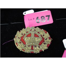 Vintage brass uniform badge