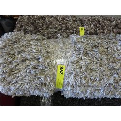 Beige shag area carpet 5' x 8'