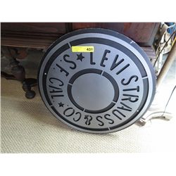 Levi Strauss 26" dia. sign in wood & metal