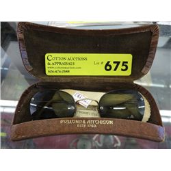 Pair of vintage sunglasses in case.