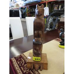 Carved totem statuette. 14" tall, 5" x 4" at base