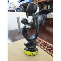 Carved stone statue 10" tall, 3" x 2" at base.