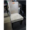 Image 1 : Four upholstered beige microfiber dining chairs