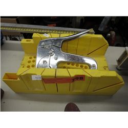 Miter box and a stapler
