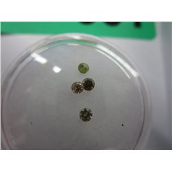 Four genuine round cut diamonds