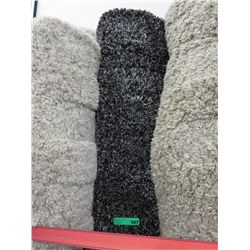 Black shag carpet. Approx. 9' x 12