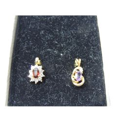 2 GOLD TONE AND JEWEL CHARMS