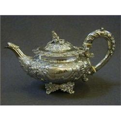 A BACHELOR TEAPOT, melon shaped, floral repousse, cast collet foot, cast finial, maker Samuel Hay
