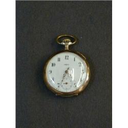 AN OMEGA VEST POCKET WATCH, Arabic dial, topwind, engine turned continental case, in a carved tre