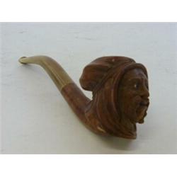 A BRIAR WOOD TOBACCO PIPE, carved Arabic head with inset agate eyes, length 20cm  30-50