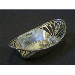 A SILVER OVAL BON BON DISH, reeded border, pierced Art Nouveau sides, maker RB, Sheffield 1911, r