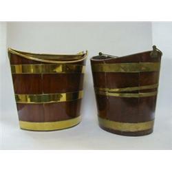 A MATCHED PAIR OF MAHOGANY PEAT BUCKETS, c.1800, tapered boat shape, brass hoops, oak bases, one