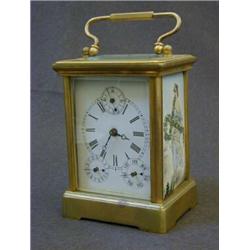 A BRASS CARRIAGE TIMEPIECE, enamel Roman dial with subsidiary seconds and calender dials, inset c